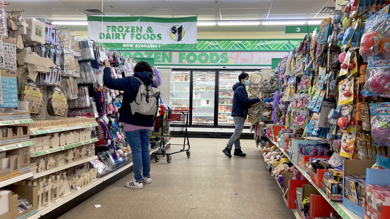 people shopping inside Dollar Tree store