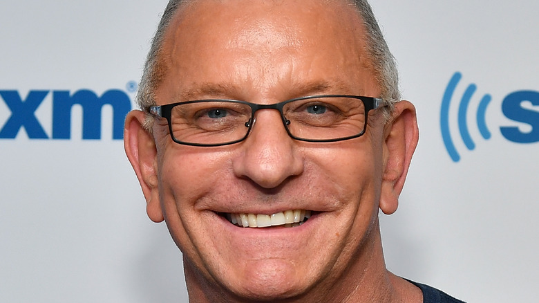 Robert Irvine smiling at an event 