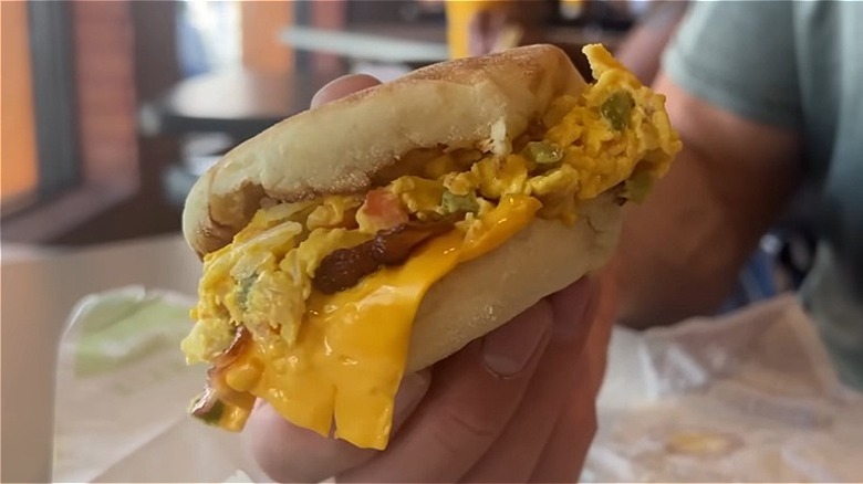 Hand holding the McMuffin a la Mexicana