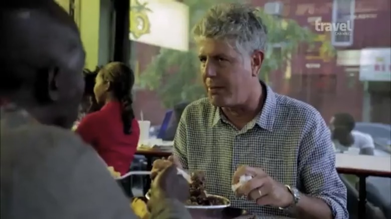 Anthony Bourdain and Michael K. Williams sitting at table