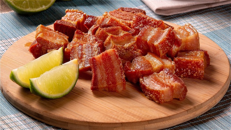 pork belly on plate with lime