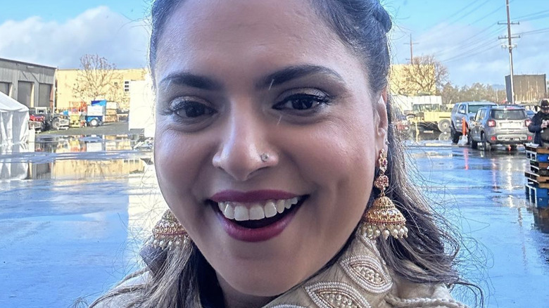 Maneet Chauhan smiling for selfie outside