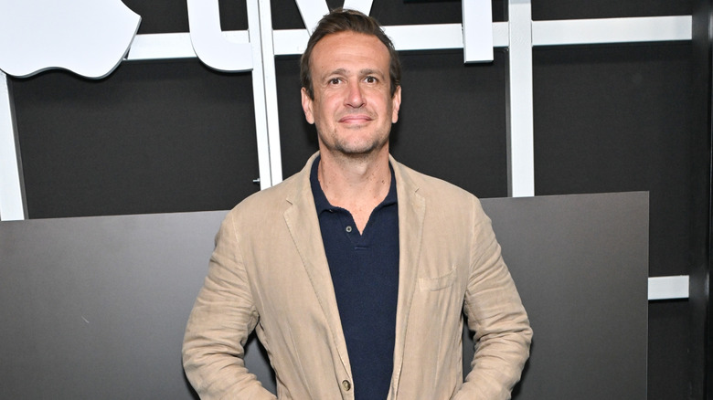 Jason Segel smiling in suit