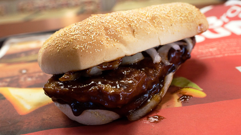 Close-up of McRib sandwich on tray
