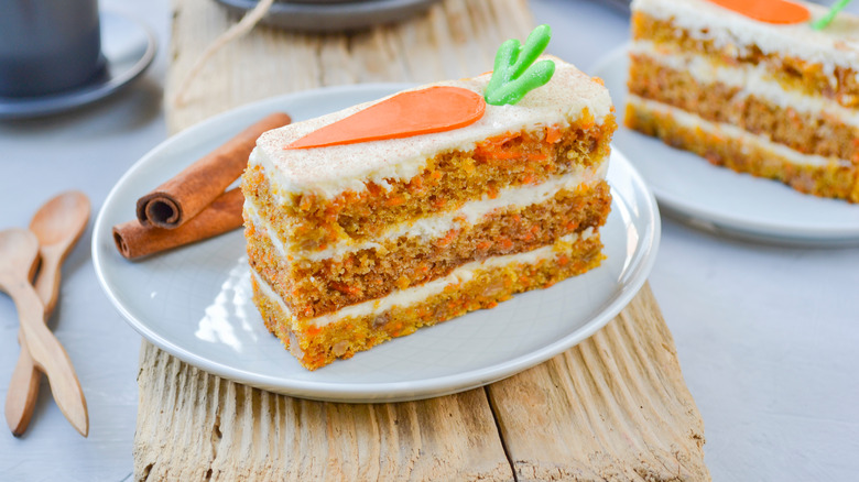 Slice of layered carrot cake on plate