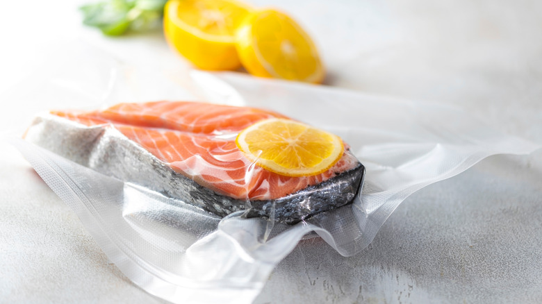 vacuum-packed frozen salmon with lemon