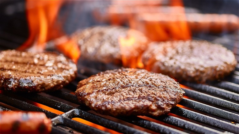 Hamburgers cooking on a grill