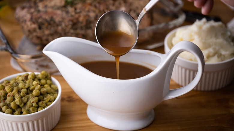 brown gravy spooned with ladle