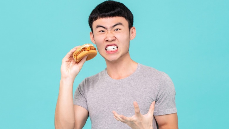angry man with burger