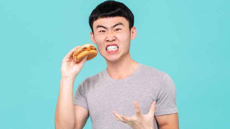 angry man with burger