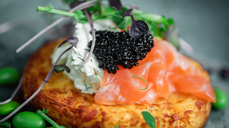 Caviar on salmon and potato pancake 