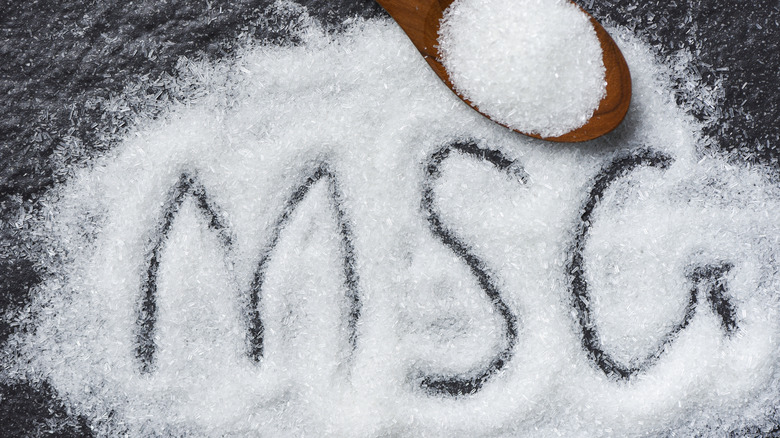 Grains of white MSG and a spoon