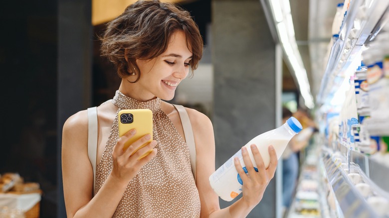 woman looking at milk