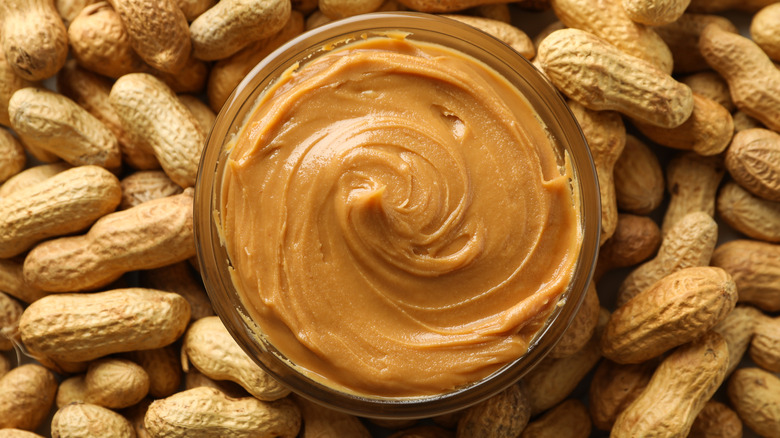 peanut butter surrounded by peanuts