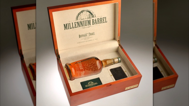 wooden collector's box with The Sixth Millionth Barrel bourbon bottle and accompanying memorabilia