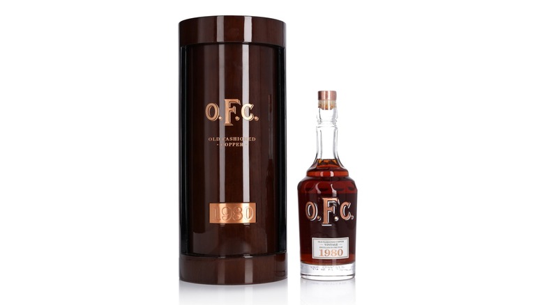 Bottle of 1980 Old Fashioned Copper Bourbon with the decorative box on a white background