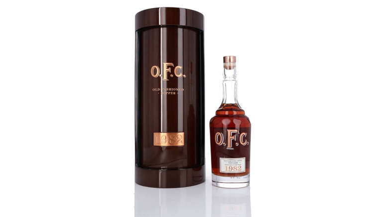 Bottle of 1982 Old Fashioned Copper Bourbon with the decorative box on a white background