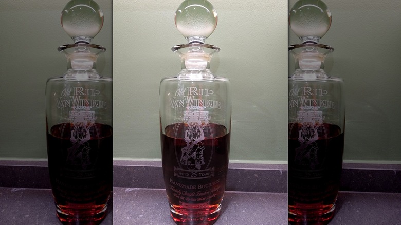partially full bottle of Rip Van Winkle 25-year old bourbon whiskey