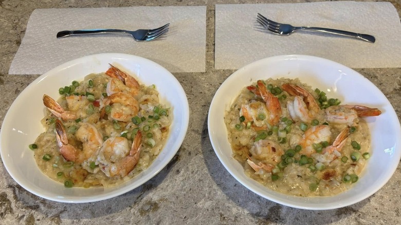 two helpings of shrimp and rice casserole in a white bowl