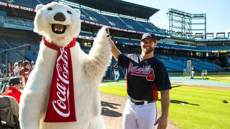 Coke Bear high-fiving Braves player