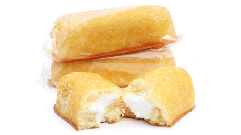 Three Twinkies stacked on a white background