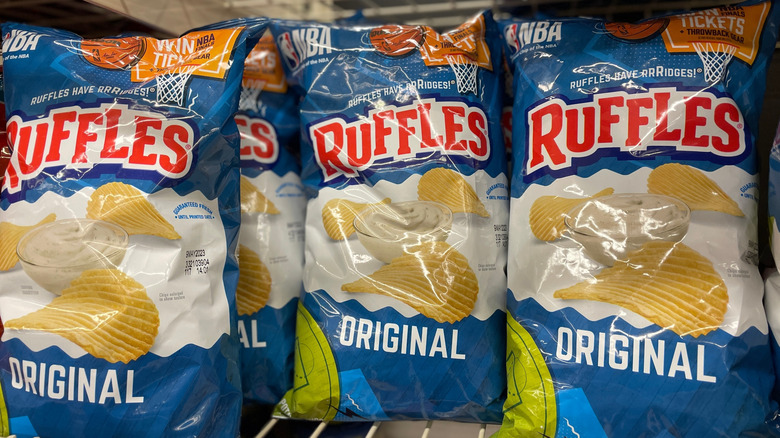 Bags of Ruffles chips on a store shelf