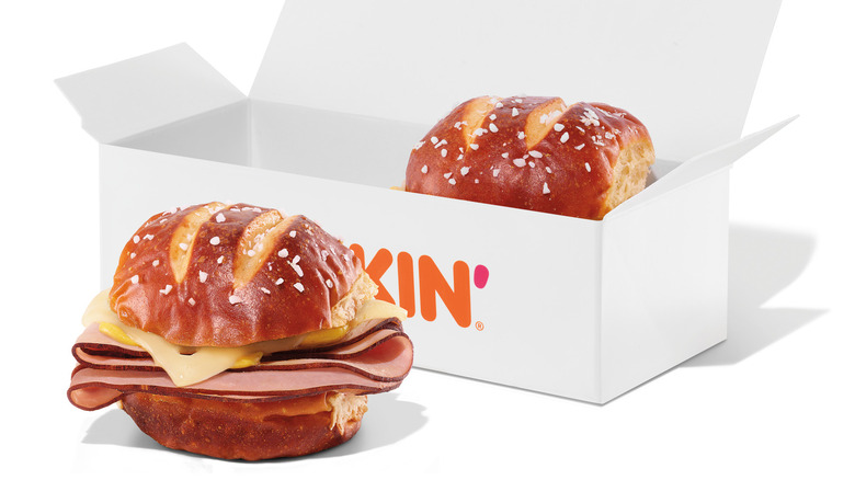 one Dunkin' slider in a box, one outside the box