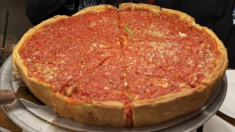 Giordano's deep dish pizza on an oven tray