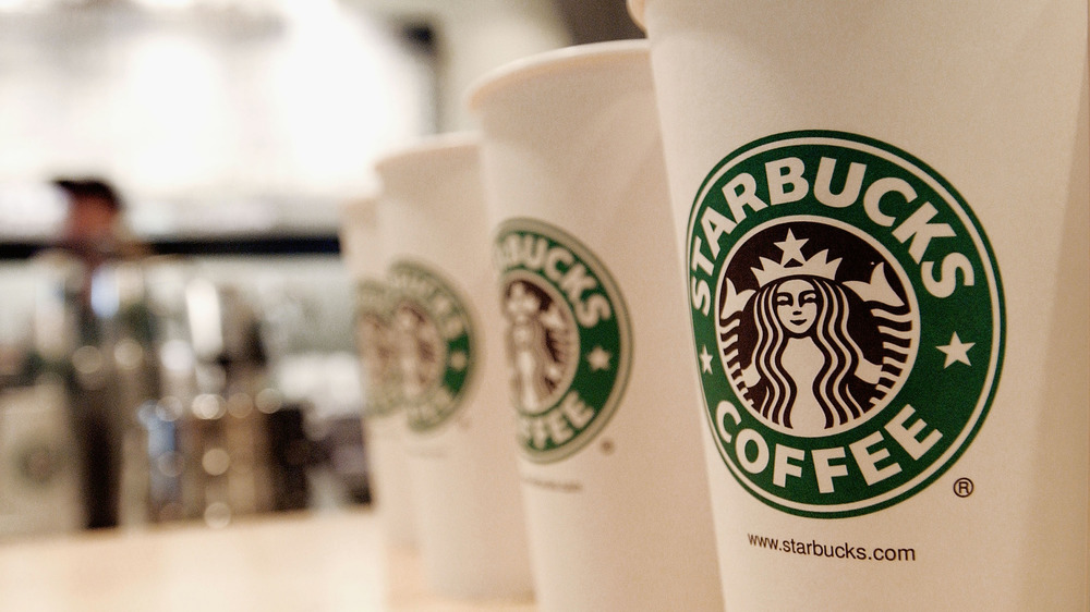 Starbucks coffee cups lined up 