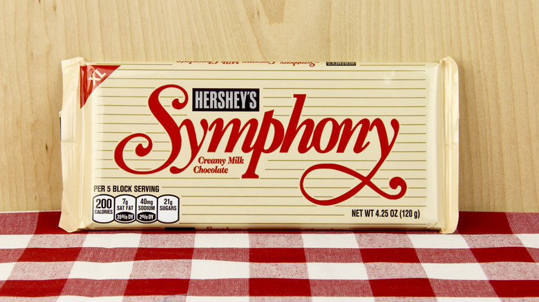Hershey's Symphony bar against a red checked cloth and wooden background 