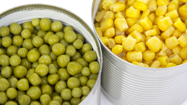 Cans of green peas and corn