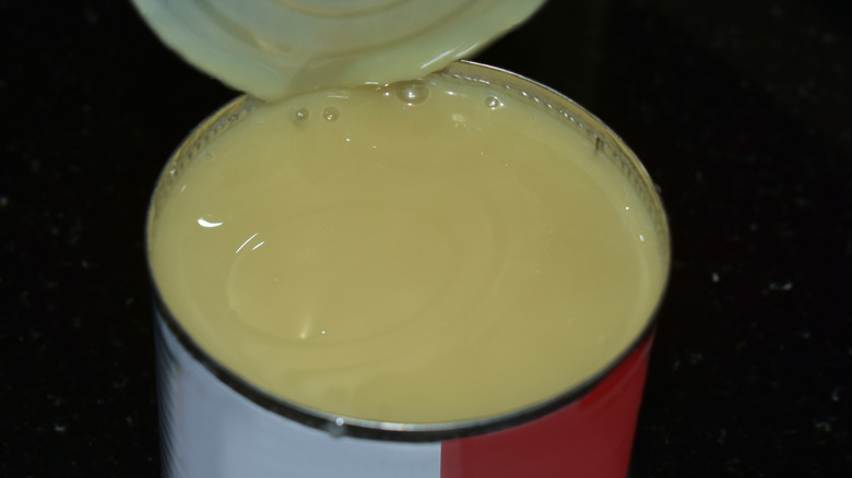 Sweetened condensed milk can with black background