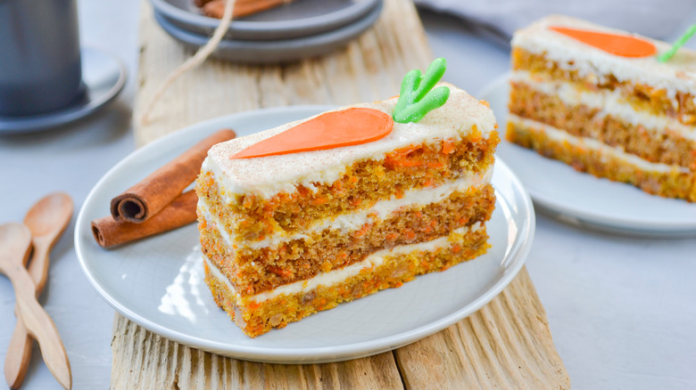 Slice of Carrot Cake and Cinnamon Sticks
