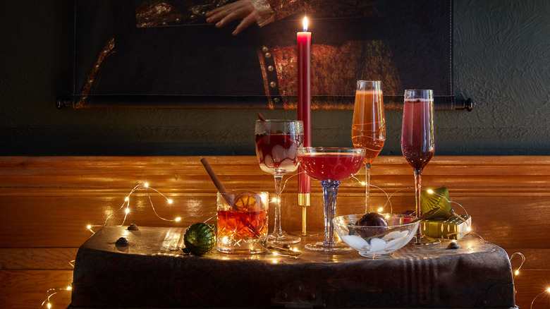 Holiday drinks on table next to candles