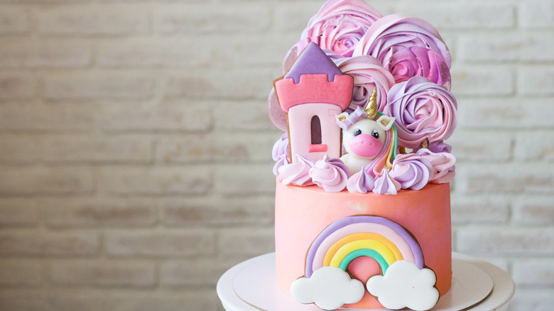 elaborate castle unicorn cake