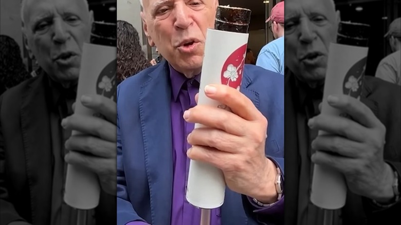 A man tries out Suka Sushi's pop-up sushi rolls in New York