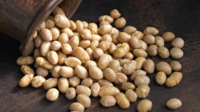 roasted soybeans spilling from jar