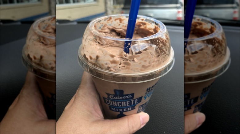 Hand holding a Culver's Chocolate Concrete Mixer with Andes Mints