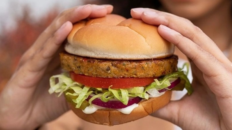 Hands holding a Culver's Harvest Veggie Burger