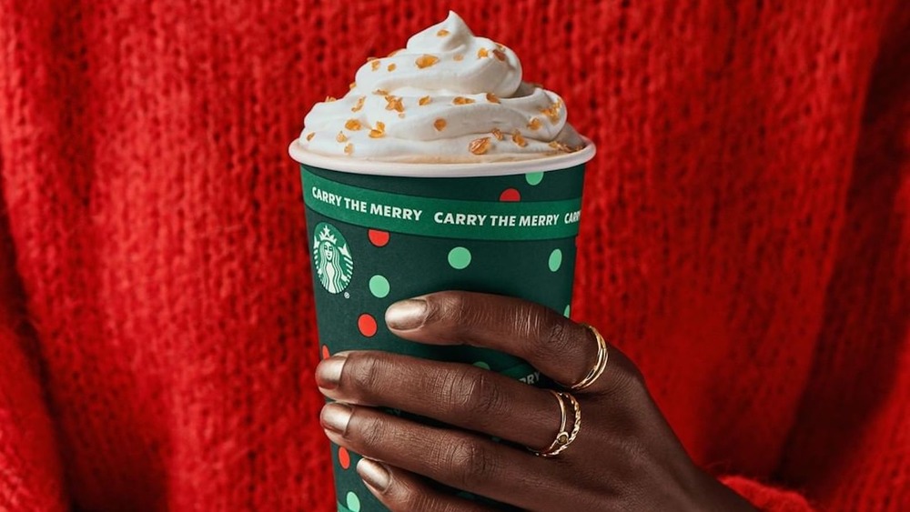 Starbucks Holiday drink in hand