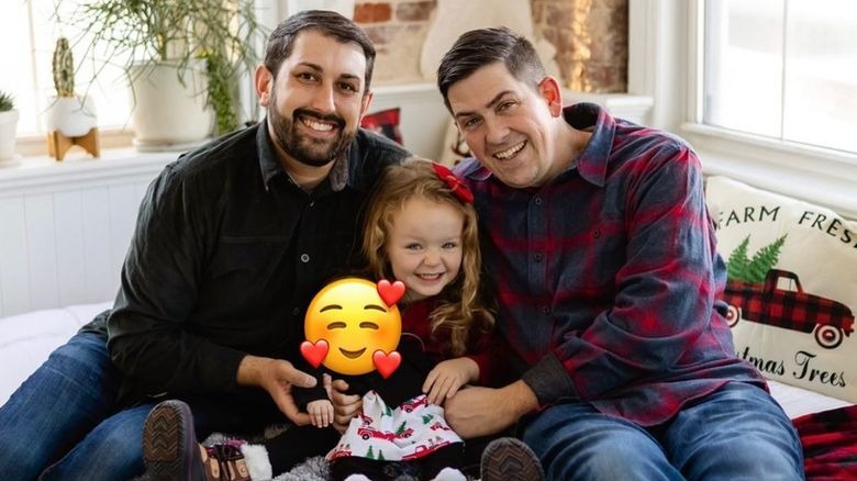 A happy Nick and his family