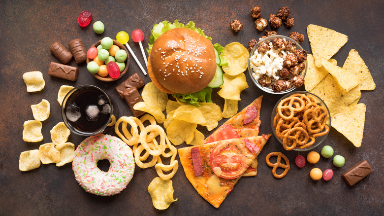 assorted candies, burger, pizza, other foods