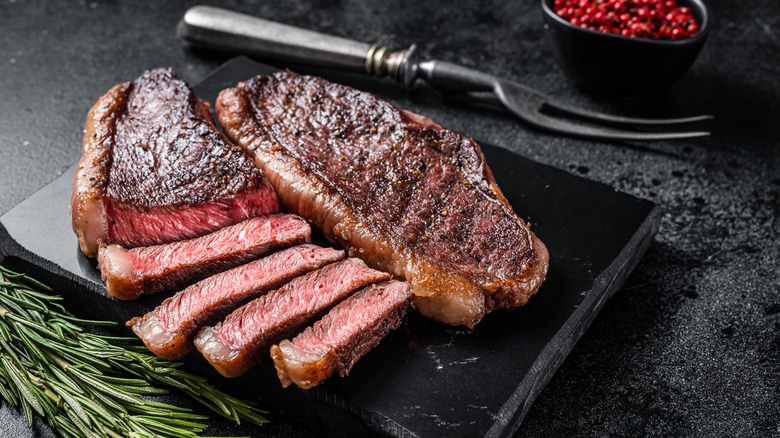 steak on board with fork