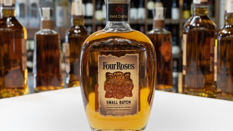 Bottle of Four Roses Small Batch in front of other bottles