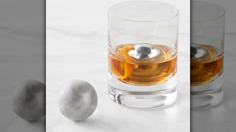 Stainless steel chilling balls in a glass of whiskey