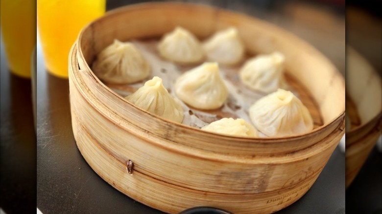 aAbamboo steamer of soup dumplings