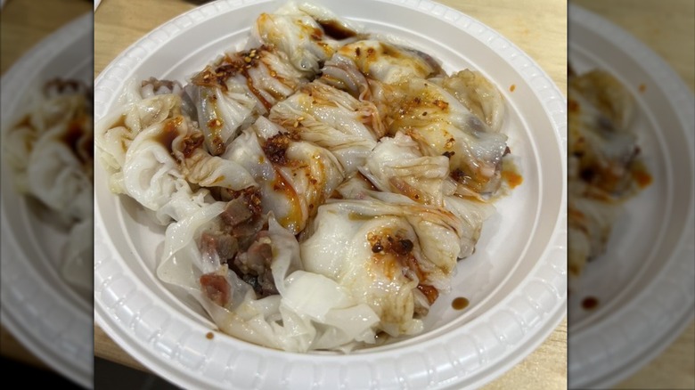 Roast pork rice roll on a styrofoam plate
