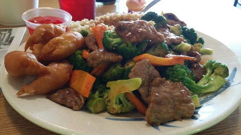 Beef and broccoli on a white plate