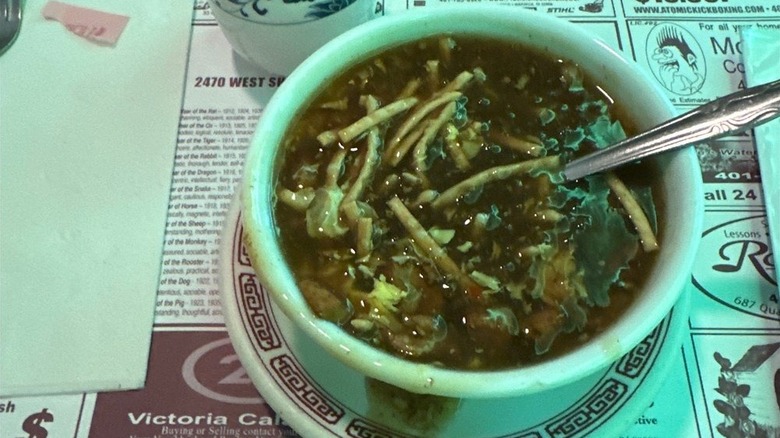 Hot and sour soup in a white bowl
