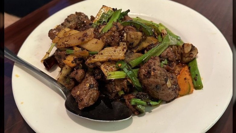 Chongqing Hot Pepper Lamb on a white plate